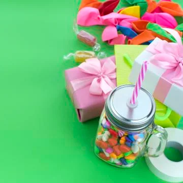 Festive composition set of gift boxes with balls candy cocktail materials. Stock Photos