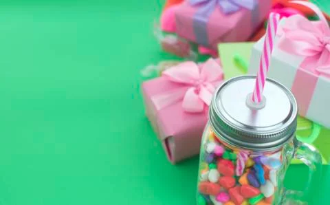 Festive composition set of gift boxes with balls candy cocktail materials. Stock Photos