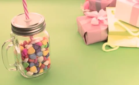 Festive composition set of gift boxes with balls candy cocktail materials. Stock Photos