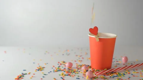 A festive composition of sweets, pastry topping, a paper cup Stock Footage 138793239