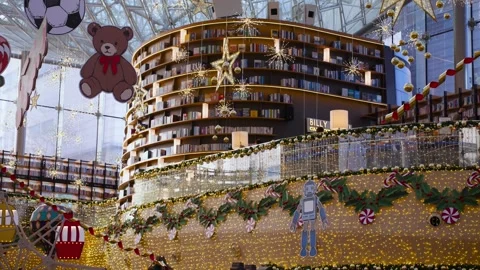 Festive Cutout Decorations Featuring Toys and Robot Hanging in Modern Shopping Stock Footage 323875562