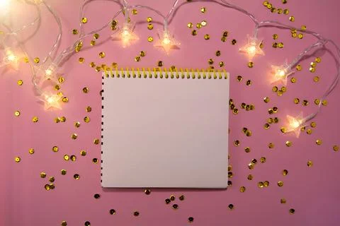 Festive decorations and notebook Stock Photos