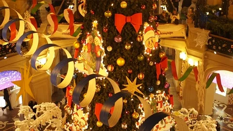 Festive decorations in the mall. Christmas tree with different Xmas toys and Stock Footage 145154430