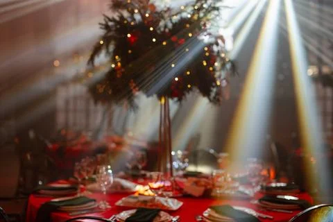 Festive dining table with elegant decorations and soft lighting Stock Photos