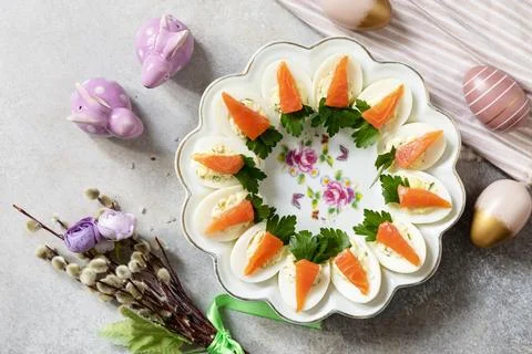 Festive dinner, Easter brunch. Stuffed eggs with cheese and salted salmon i.. Foto stock
