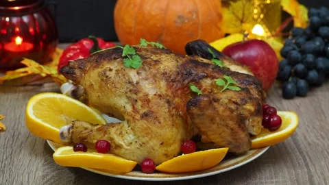 Festive dinner at home. chicken with oranges. Thanksgiving or Christmas dinner 스톡 동영상 257595361