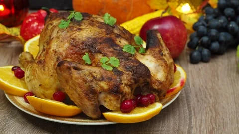 Festive dinner at home. chicken with oranges. Thanksgiving or Christmas dinner 스톡 동영상 257596000