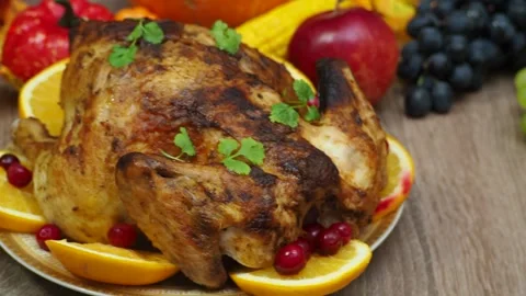 Festive dinner at home. chicken with oranges. Thanksgiving or Christmas dinner 스톡 동영상 257596502