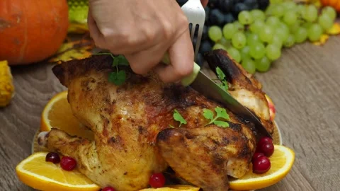 Festive dinner at home. chicken with oranges. Thanksgiving or Christmas dinner Stock Footage 257599353