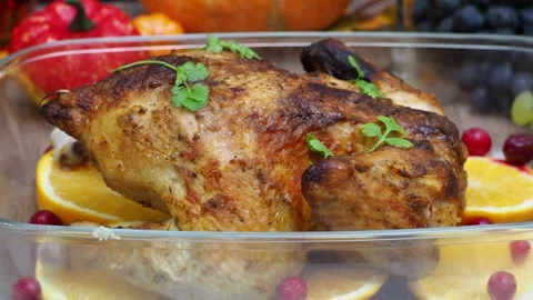 Festive dinner at home. chicken with oranges. Thanksgiving or Christmas dinner Stock Footage 257601729