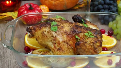 Festive dinner at home. chicken with oranges. Thanksgiving or Christmas dinner Stock Footage 257601735