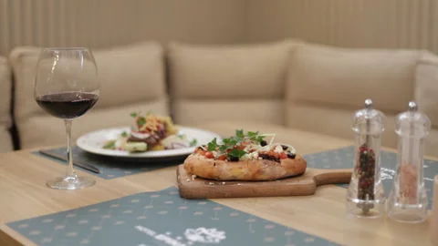 Festive dinner at a well-served table with tasty dishes at the luxury restaurant Stock Footage 170071453