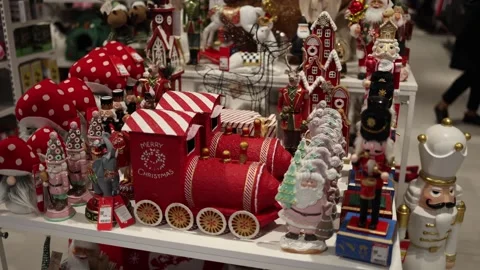 A festive display of Christmas decorations featuring a red toy train, nutcracker Stock Footage 291848279