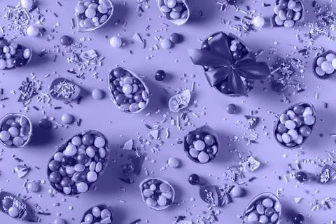 Festive Easter background with chocolate eggs and sweets Stock Photos