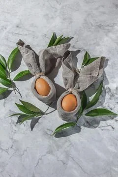 Festive easter background with Easter bunny eggs on linen napkin. Easter deco Stock Photos