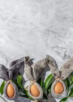 Festive easter background with Easter bunny eggs on linen napkin. Easter de.. Stock Photos