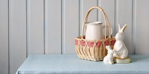 Festive Easter background. Easter bunny figurines on the table. copy space. Stock Photos