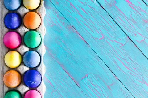 Festive Easter border of hand dyed eggs Stock Photos