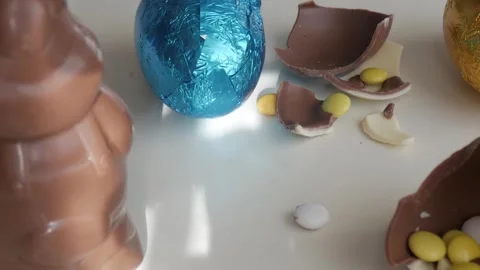 Festive Easter Chocolate Bunny and Candy-Filled Egg Delight Stock Footage 332943716