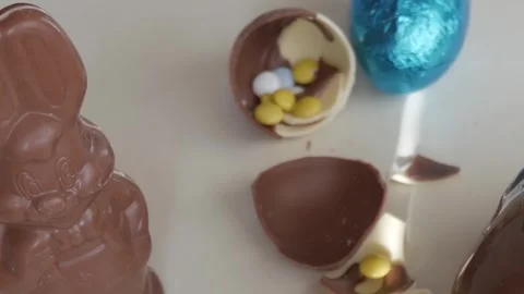 Festive Easter Chocolate Bunny and Colorful Egg Candy Treats Stock Footage 332943807
