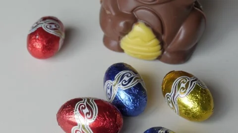 Festive Easter Chocolate Eggs and Adorable Bunny for Celebration Stock Footage 331830014