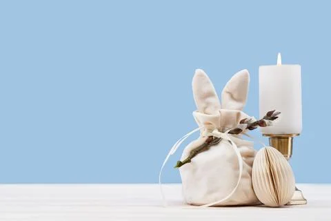 Festive Easter concept with gift bag and egg Stock Photos