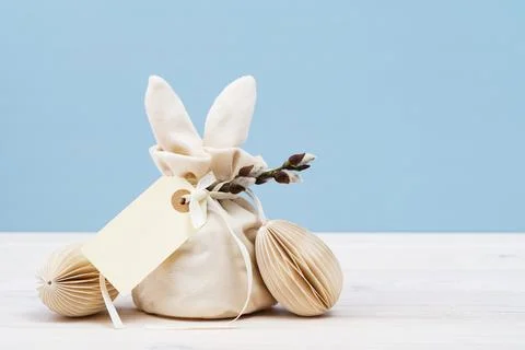 Festive Easter concept with gift bag and egg Stock Photos