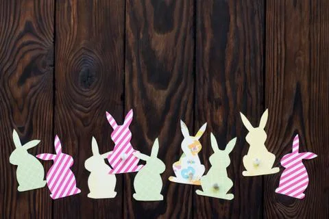 Festive Easter decor with handmade decoration of colorful rabbits. Stock Photos