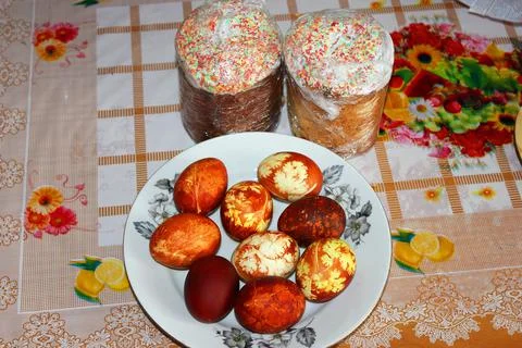 Festive Easter eggs and Easter cakes. Stock Photos