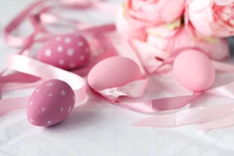 Festive easter eggs on table with ribbons Stock Photos