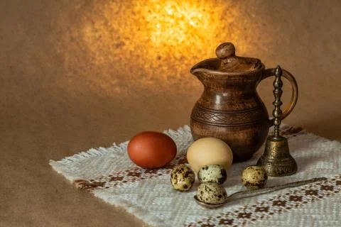 Festive Easter still life with eggs and earthenware jug. Blank for postcards. Stock Photos