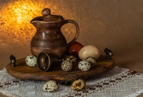 Festive Easter still life with eggs and earthenware jug. Blank for postcards. Stock Photos