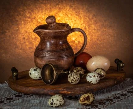 Festive Easter still life with eggs and earthenware jug. Blank for postcards. Stock Photos