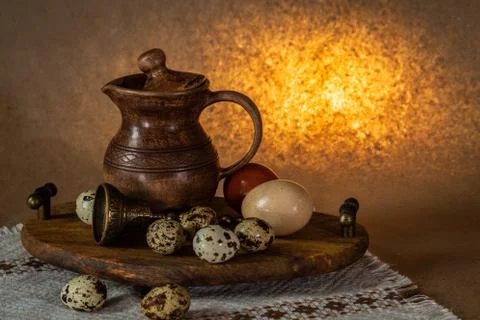 Festive Easter still life with eggs and earthenware jug. Blank for postcards. Stock Photos