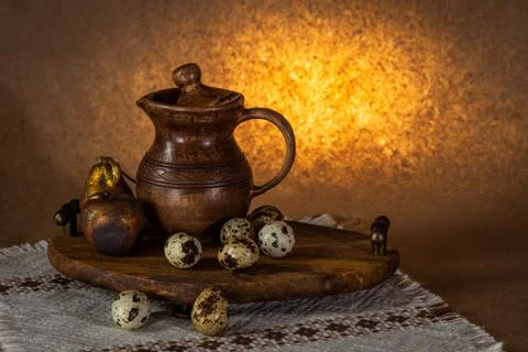 Festive Easter still life with eggs and earthenware jug. Blank for cards. Stock Photos