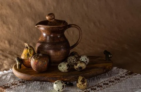 Festive Easter still life with eggs and earthenware jug. Blank for cards. Stock Photos