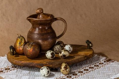 Festive Easter still life with eggs and earthenware jug. Blank for cards. Stock Photos