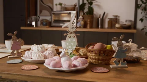 Festive Easter Table with Rabbits Decorations and Dyed Eggs Stock Footage 327888749