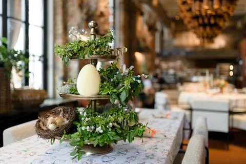 Festive Easter Table Setting with Decorative Eggs and Spring Flowers Stock Photos