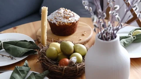Festive Easter table setting with Easter bunny made of linen napkin and egg. Top Stock Footage 235658713