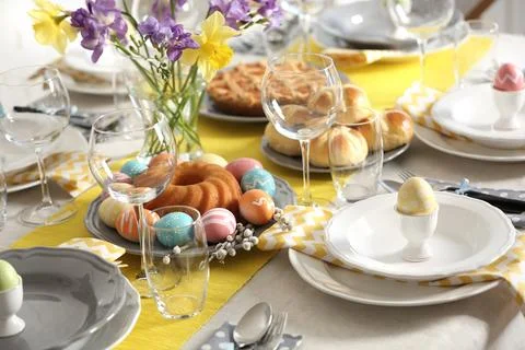 Festive Easter table setting with traditional meal Stock Photos