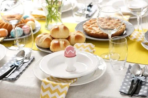 Festive Easter table setting with traditional meal Stock Photos