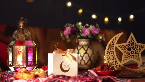 A festive Eid table with food, sweets, and wrapped presents Stock Footage 308444425