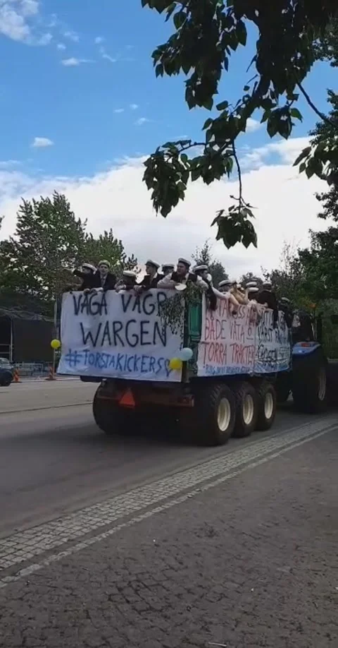 Festive end of the year among Swedish students in the trailer of a tractor Stock Footage 237761186