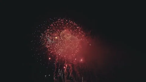 Festive fireworks exploding in the night sky. Heart-shaped fireworks show. Stock Footage 173469476