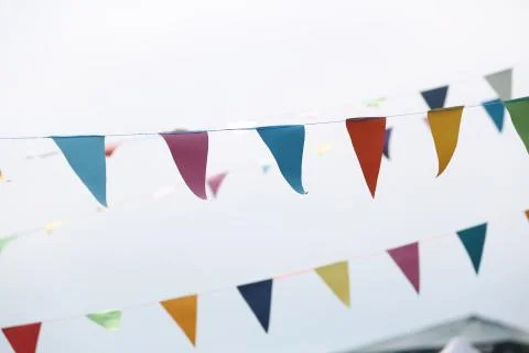 Festive flags on grey background. Close up Stock Photos