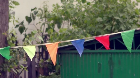 Festive flags in the yard Stockbeeldmateriaal 90489689