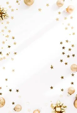 Festive flat-lay arrangement featuring golden Christmas ornaments, glittery.. Stock Photos
