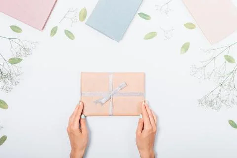 Festive flat lay composition with books, dry leaves and present Stock Photos