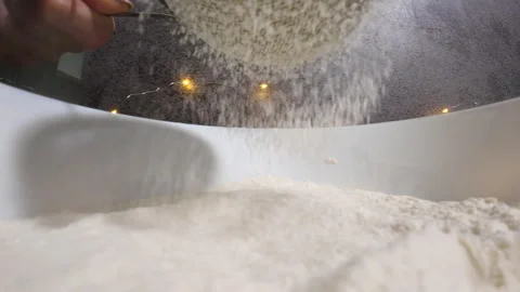 Festive Flour Magic: Close-Up of Sowing Flour for Christmas Cookies Stock Footage 255341642